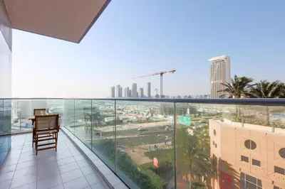 a balcony with a view of a city at 1BR with Balcony, Steps from JBR & Marina Walk in Dubai