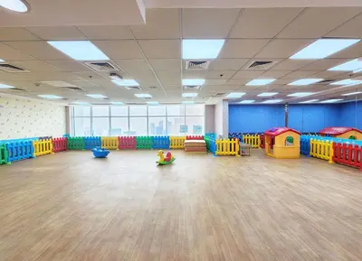 a large room with brightly colored play equipment in it at RH- Modern studio walk away from Burj khalifa and Dubai Mall in Dubai