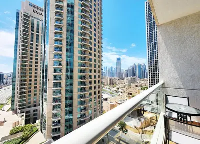an apartment balcony with a view of a city at RH- Contemporary Living, Studio, Near Burj Khalifa in Dubai