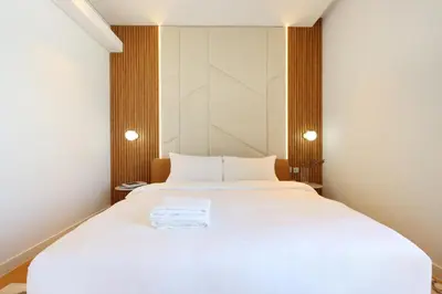 a bedroom with a large white bed in a room at Livbnb - Alluring 3BR Plus Maid's with Sea & Ain Dubai View in Dubai