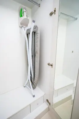 a bathroom with a shower and a mirror at Alashrafia Saray- Splendid 1BR apartment in Canal Views in Dubai