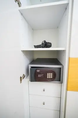 a microwave on a shelf in a room at Alashrafia Saray- Splendid 1BR apartment in Canal Views in Dubai