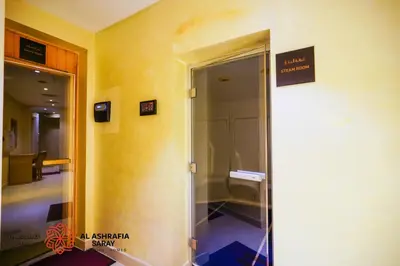 an elevator in a building with a sign on the wall at Alashrafia Saray- Splendid 1BR apartment in Canal Views in Dubai