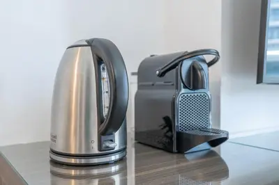 a coffee maker and a toaster on a counter at Sleek Studio in Dubai's Vibrant JBR Neighborhood in Dubai
