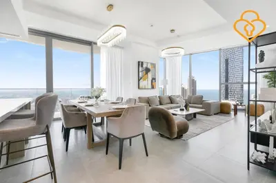 a living room with a table and some chairs at Keysplease Luxury 3 B/R Fascinating Sea & Dubai Marina Views in Dubai