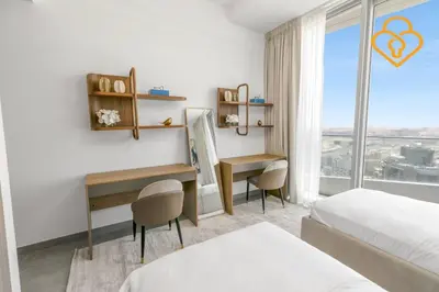 a bedroom with two beds and a desk and a window at Keysplease Luxury 3 B/R Fascinating Sea & Dubai Marina Views in Dubai