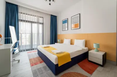 a hotel room with a bed and a window at Izzzi Life Mint in Dubai