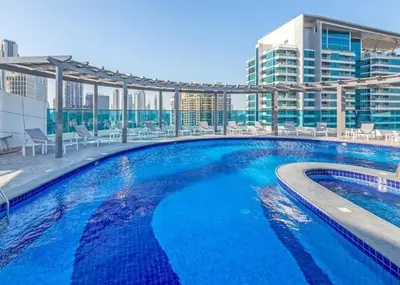 a large swimming pool on the roof of a building at Canal View l Stylish & Spacious in Dubai