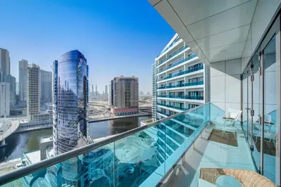 a view of a city from the balcony of a building at Canal View l Stylish & Spacious in Dubai