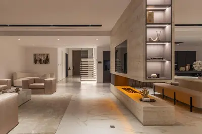 a living room with a couch and a table at Palm Jumeirah Paradise - 5BR Villa - Infinity Pool in Dubai