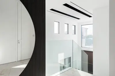 a staircase in a house with white walls and glass floors at Palm Jumeirah Paradise - 5BR Villa - Infinity Pool in Dubai