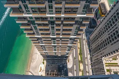 an overhead view of a building on the beach at Bright and cozy 1BD apartment on the Beachfront in Dubai
