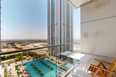 a view of a large building with a swimming pool at Meera Tower - Sleek One Bedroom in Dubai