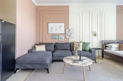 a living room with a couch and a table at GuestReady - Luxe Studio with JLT Park View in Dubai