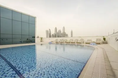 a swimming pool on the roof of a building at GuestReady - Luxe Studio with JLT Park View in Dubai