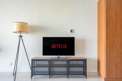 a tv sitting on top of a table in a room at GuestReady - Luxe Studio with JLT Park View in Dubai