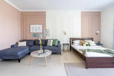 a living room with a bed and a couch at GuestReady - Luxe Studio with JLT Park View in Dubai