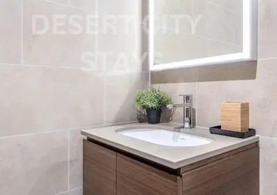 a bathroom with a sink and a window at 2 Bed in Sobha Creek Vista Reserve with Burj Khalifa views hosted by Desert City Stays in Dubai