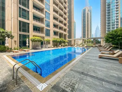 a large swimming pool in the middle of a building at Silkhaus spacious studio in Boulevard Central with gym & pool in Dubai