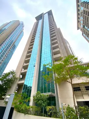 a tall building with glass windows in a city at Silkhaus spacious studio in Boulevard Central with gym & pool in Dubai