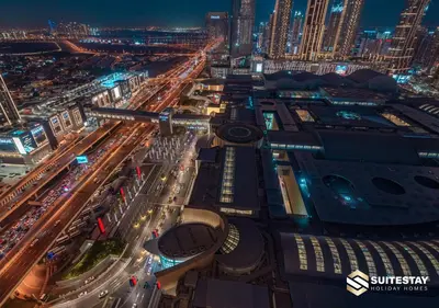 an aerial view of a city at night at Deluxe - Address Dubai Mall - The Residence in Dubai