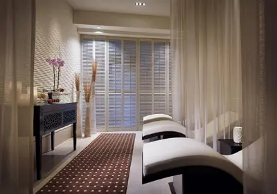 a living room with a row of stools in front of a window at Deluxe - Address Dubai Mall - The Residence in Dubai