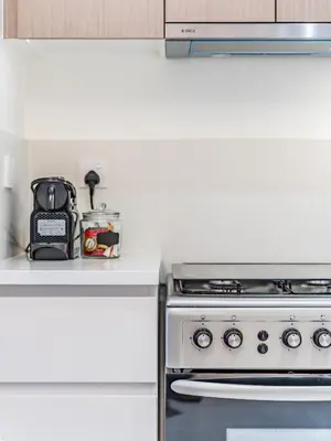 a kitchen with a stove and a counter top at Stylish 1BR in Park Heights 2 - Dubai Hills in Dubai