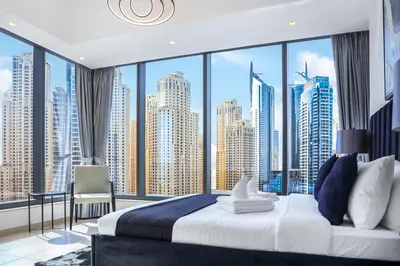 a bedroom with a large window with a view of the city at Panoramic Luxe 1BR with Breathtaking Views at Dubai Marina Near JBR - Silverene Towers in Dubai