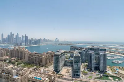 an aerial view of a city with buildings and a harbor at GuestReady - Bejeweled Studio at The Palm Tower in Dubai