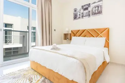 a bedroom with a large bed and a large window at Calm Aesthetic 3 Bedroom Villa in Dubai