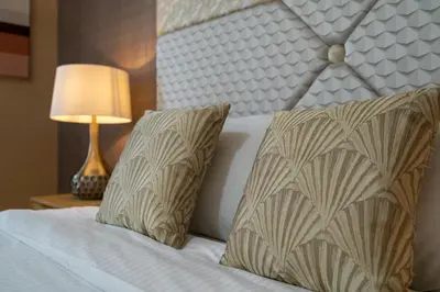 a bedroom with a bed with two pillows and a lamp at Bellavista - Graceful - 2 BR - 29 Boulevard - Fountain Views in Dubai