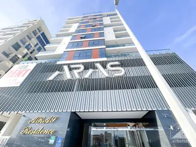 a tall building with a msg sign on it at NEW! Amazing Studio in Al Majan in Dubai
