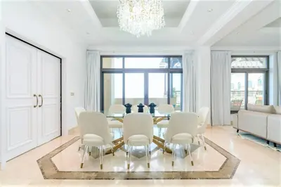 a dining room with a table and chairs at NEW! Exclusive Fairmont Penthouse private Pool-Gym in Dubai