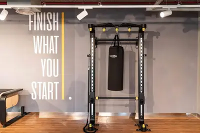 a gym cart in a room next to a wall at Prime Retreats @ Downtown Views by Emaar in Dubai