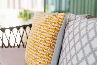 two pillows sitting next to each other on a couch at Prime Retreats @ Downtown Views by Emaar in Dubai