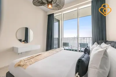 a bedroom with a large bed and a large window at Keysplease Spectacular Views Modern 1BR Creek Gate 602 in Dubai