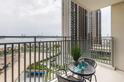 a balcony with a table and chairs and a view at Frank Porter - 17 Icon Bay in Dubai