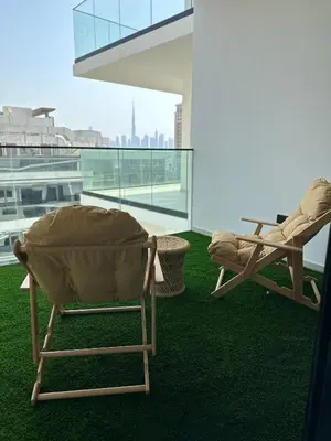 two chairs on a balcony with a view of the city at LUXURY 2 bedrooms 5 minutes from Burj Khalifa in Dubai