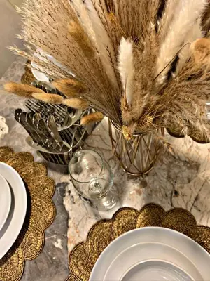 a bird is standing on a table with a plate at Royal Maison Luxurious 2 Br in Business Bay in Dubai