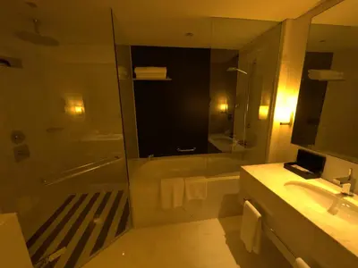 a bathroom with a shower and a sink and a mirror at Fashion Avenue - Dubai Mall in Dubai