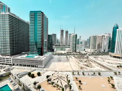 a view of a city with tall buildings at Royal Maison Deluxe 2 Br in Executive Bay in Dubai