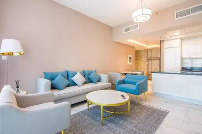 a living room with a couch and a table at Stunning 1BR AL Habtoor City -Meera Tower 1108 in Dubai