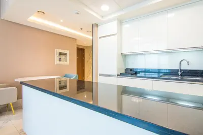 a kitchen with a large counter with a sink at Stunning 1BR AL Habtoor City -Meera Tower 1108 in Dubai