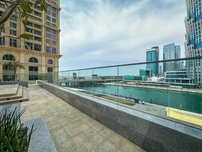 a balcony with a view of a river and buildings at Stunning 1BR AL Habtoor City -Meera Tower 1108 in Dubai
