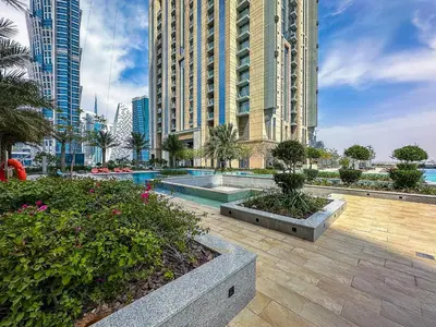 a large building with a pool in a city at Stunning 1BR AL Habtoor City -Meera Tower 1108 in Dubai