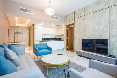 a living room with a couch and a tv at Stunning 1BR AL Habtoor City -Meera Tower 1108 in Dubai