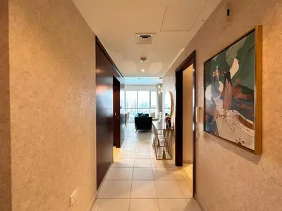 a hallway of a house with a painting on the wall at Durrani Homes - Grand 5BR besides Burj khalifa and Fountain view in Dubai
