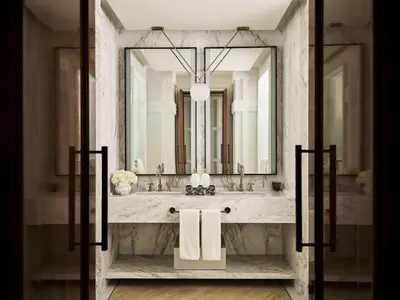 a bathroom with a sink and a mirror at The Lana - Dorchester Collection in Dubai