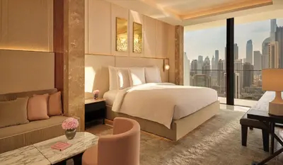 a bedroom with a bed and a view of a city at The Lana - Dorchester Collection in Dubai