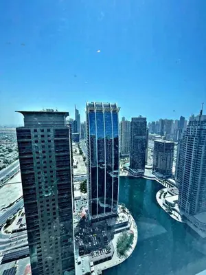 an aerial view of a city with tall buildings at Stunning Duplex Studio in JLT in Dubai